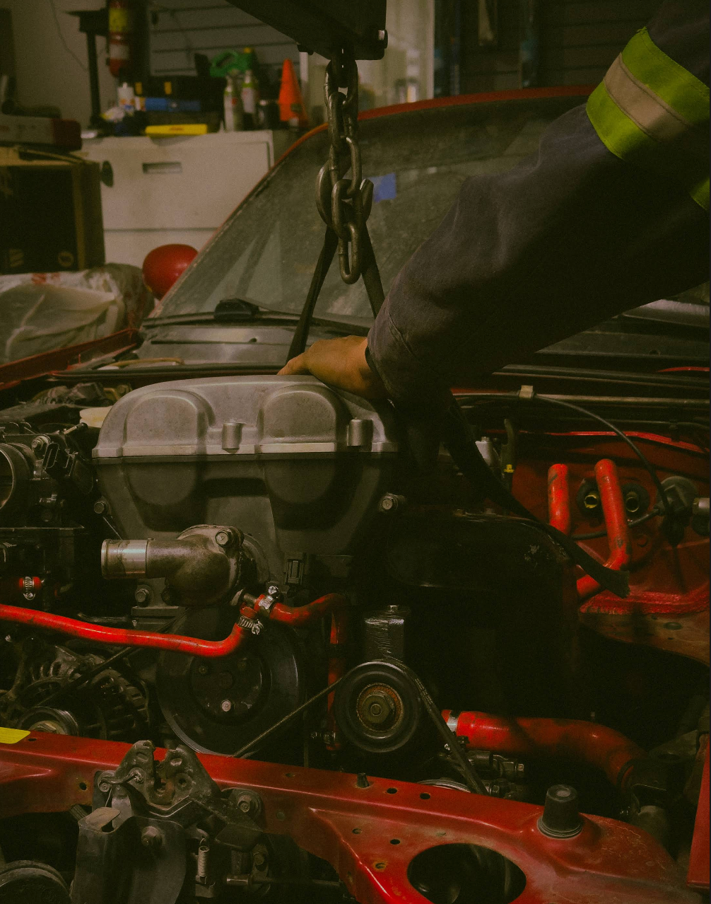 Ashtaq Auto mechanic performing engine work